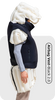 Person wearing a black fall protection airbag vest on a white background